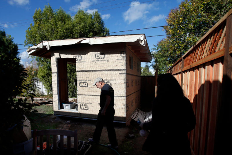 Michael Lerner builds a "granny unit" in the backyard of his house Monday, Nov. 21, 2016, in San Jose, Calif. The city recently eased restrictions on these alternative housing structures hoping to increase supply and reduce skyrocketing housing costs. (Karl Mondon/Bay Area News Group)