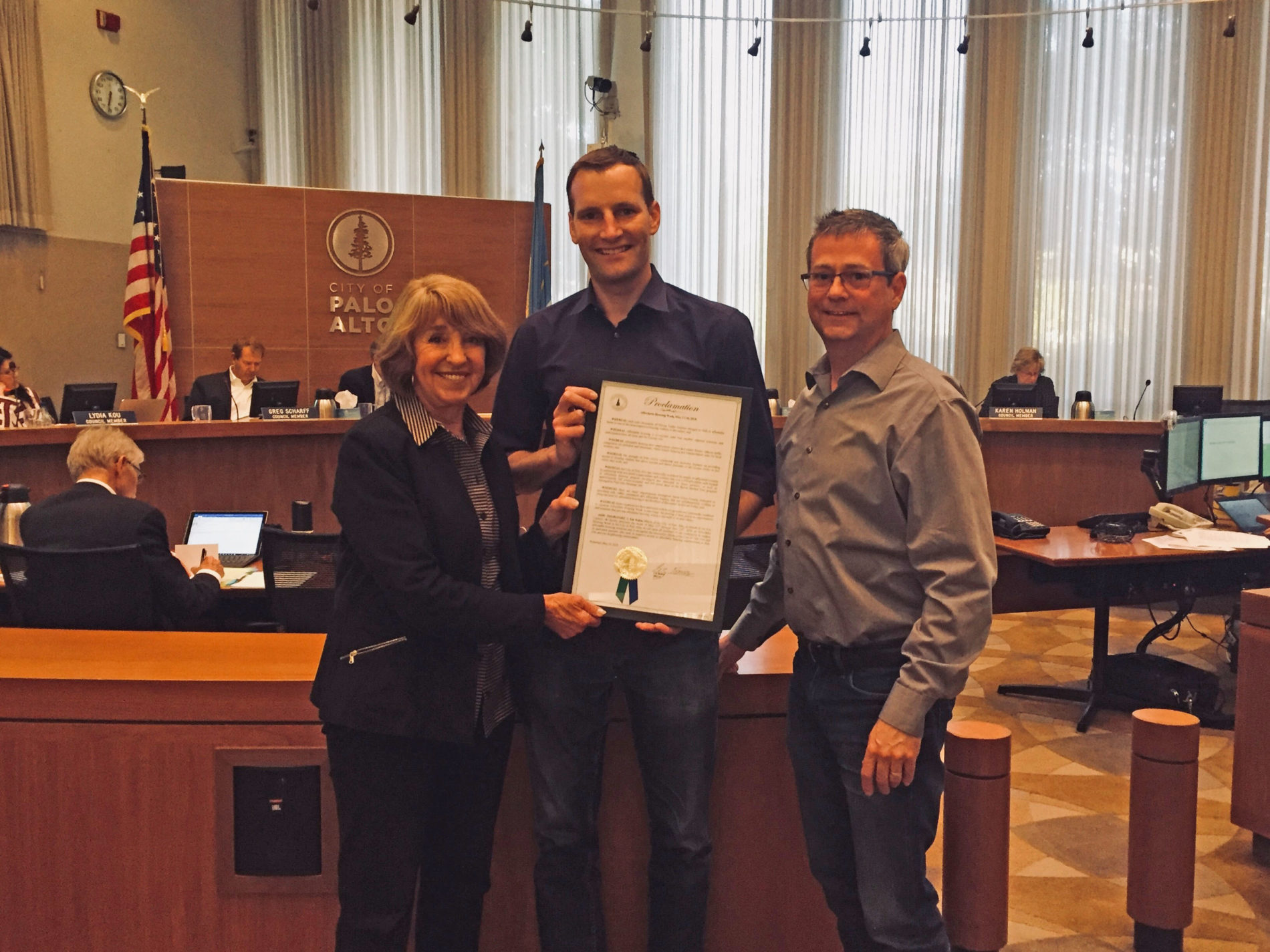 Palo Alto Mayor Liz Kniss presents proclamation to SV@Home Policy Manager Mathew Reed & Palo Alto Housing Director of Real Estate Development Rob Wilkins.