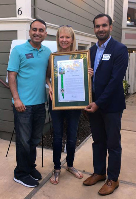 California State Assemblymember Ash Kalra and representatives from Assemblymember Kansen Chu's office presented SV@Home Executvie Director Leslye Corsiglia with a resolution recognizing the organization's three-year anniversary at a July 27 block party attended by more than  60 people in San Jose.