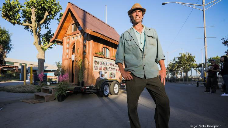Miguel Elliott, with Living Earth Structures out of Sonoma County, stands outside one of his organization's tiny homes at the TinyFest event in San Jose on June 15. Silicon Valley and state legislation intended to relax rules on accessory dwelling units, or ADUs — more commonly called "granny units" — seem to be gaining traction among lawmakers.
