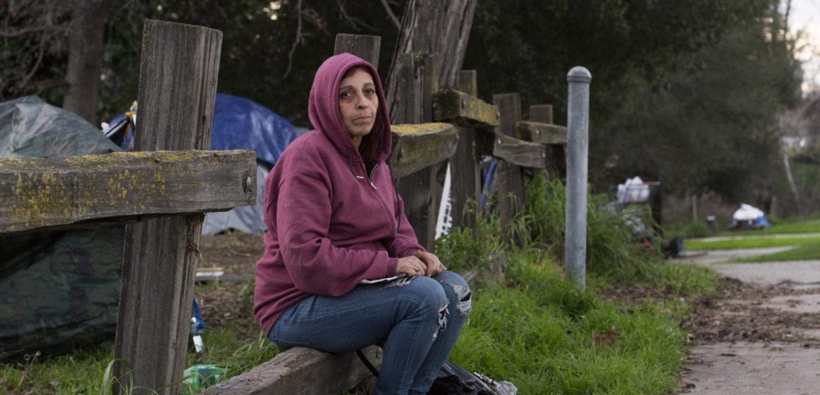 Homeless resident Elizabeth Piña, 56, sits near her encampment next to East Santa Clara Street near Roosevelt Park. She's been homeless for over six years, and suffered through abatements several times. Photo by Kyle Martin.