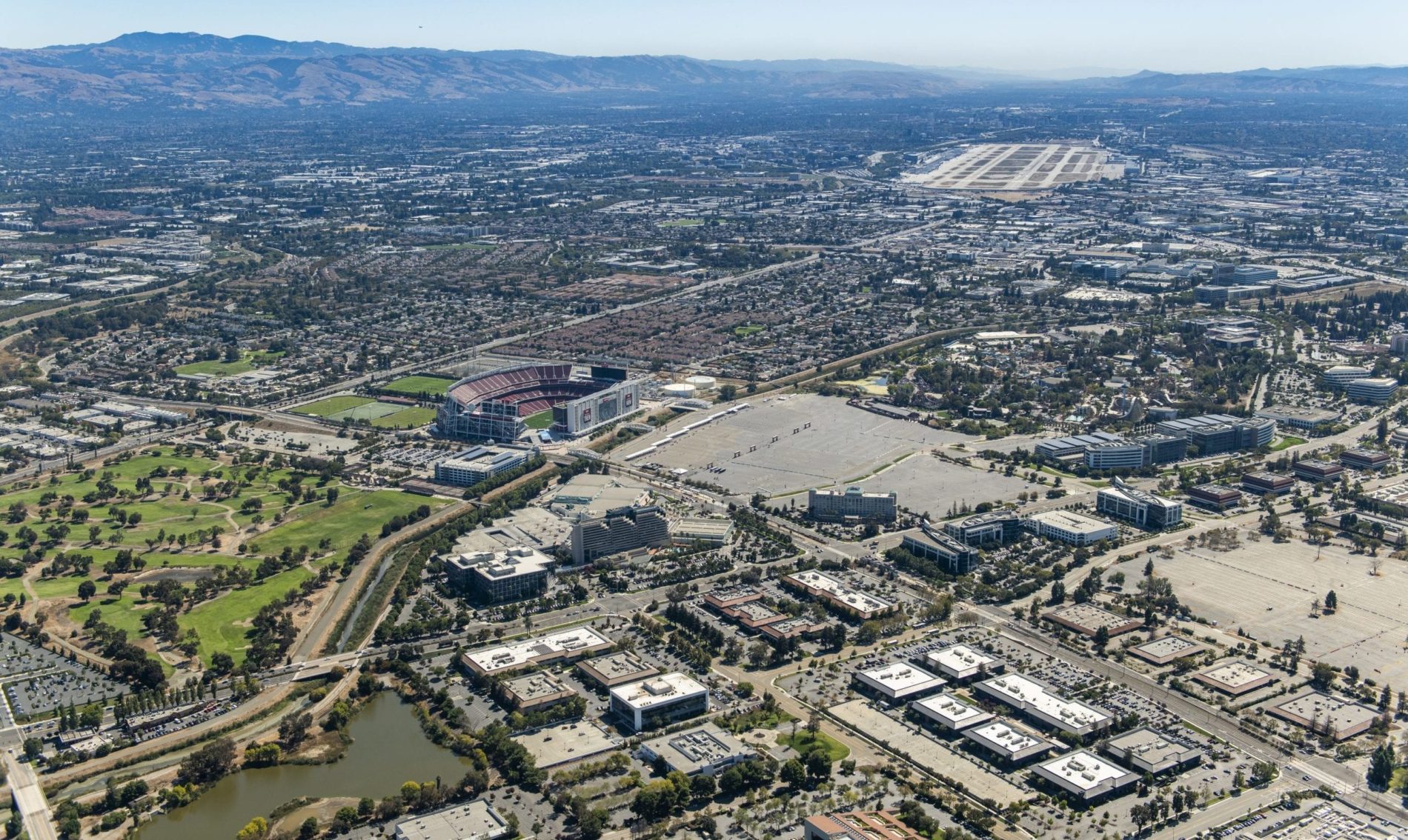 An aerial image of a part of the city of Santa Clara and North San Jose. Photo by The 111th Group.