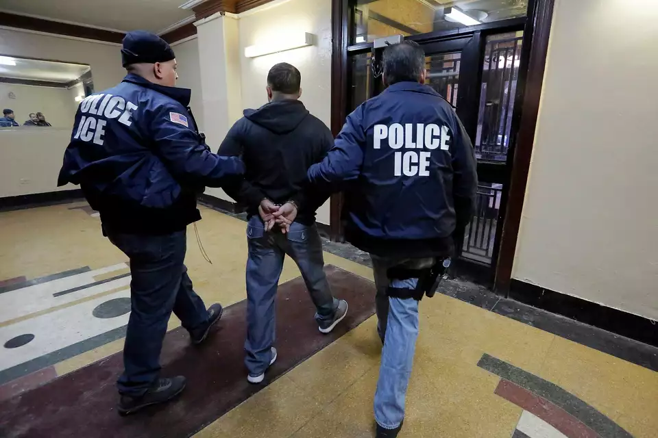 Immigration and Customs Enforcement officers making an arrest. Richard Drew/AP